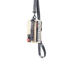 SKINARMA Fardel Clutch bag béžová / taška s popruhem